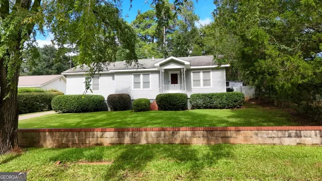 an aerial view of a house with outdoor space
