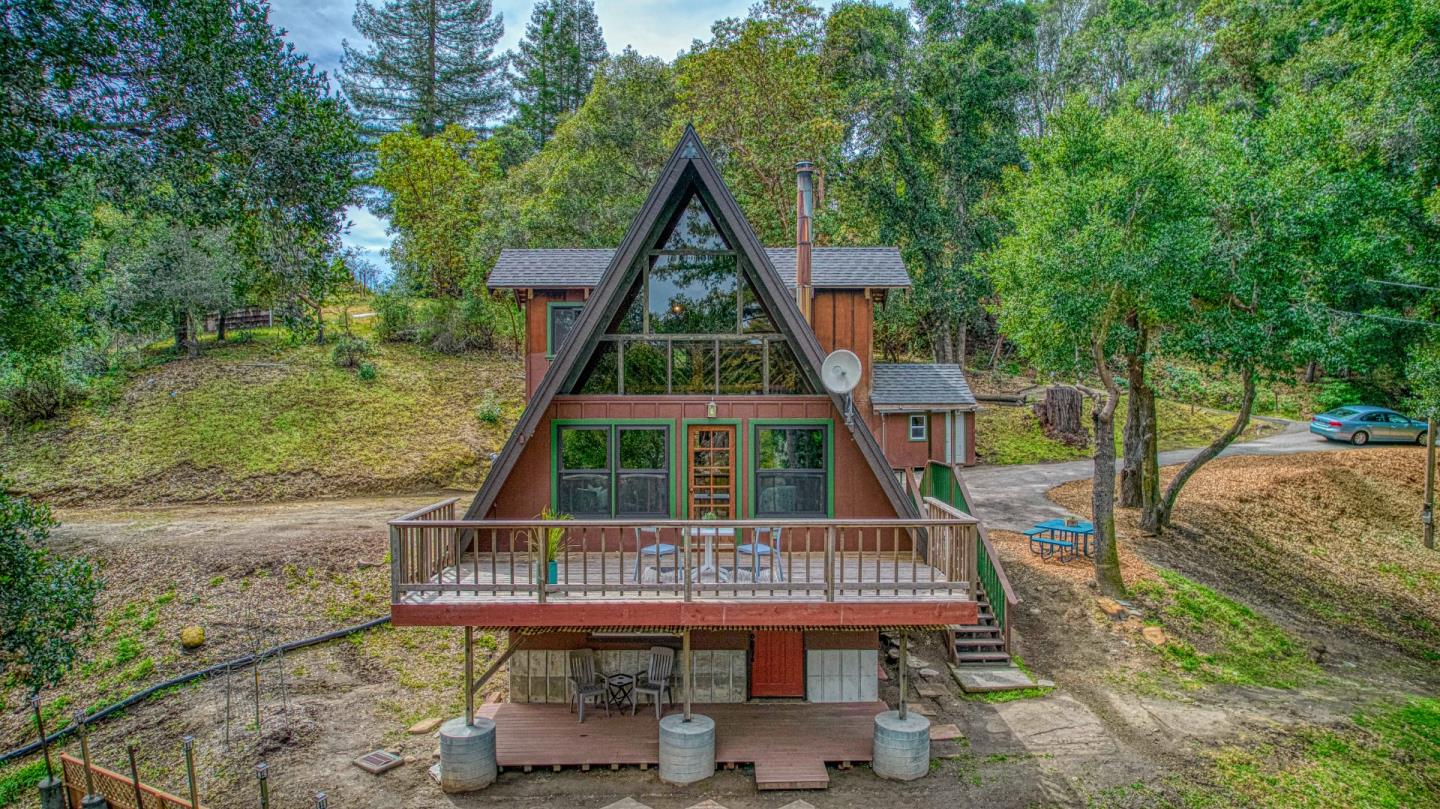 525 Bohnen Road Santa Cruz, CA 95065 - Photo 3 of 29 a view of a deck with a table and chairs