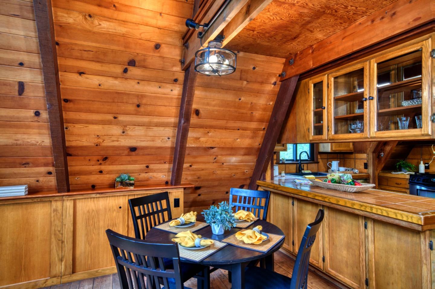 525 Bohnen Road Santa Cruz, CA 95065 - Photo 8 of 29 a roof deck with a dining table and chairs with wooden floor