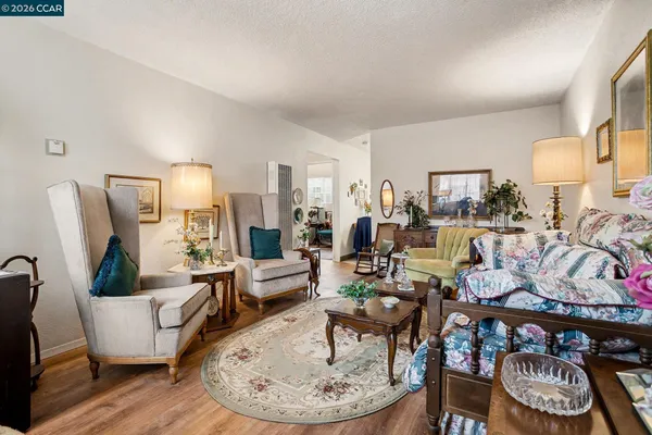 a living room with lots of furniture and a dining table