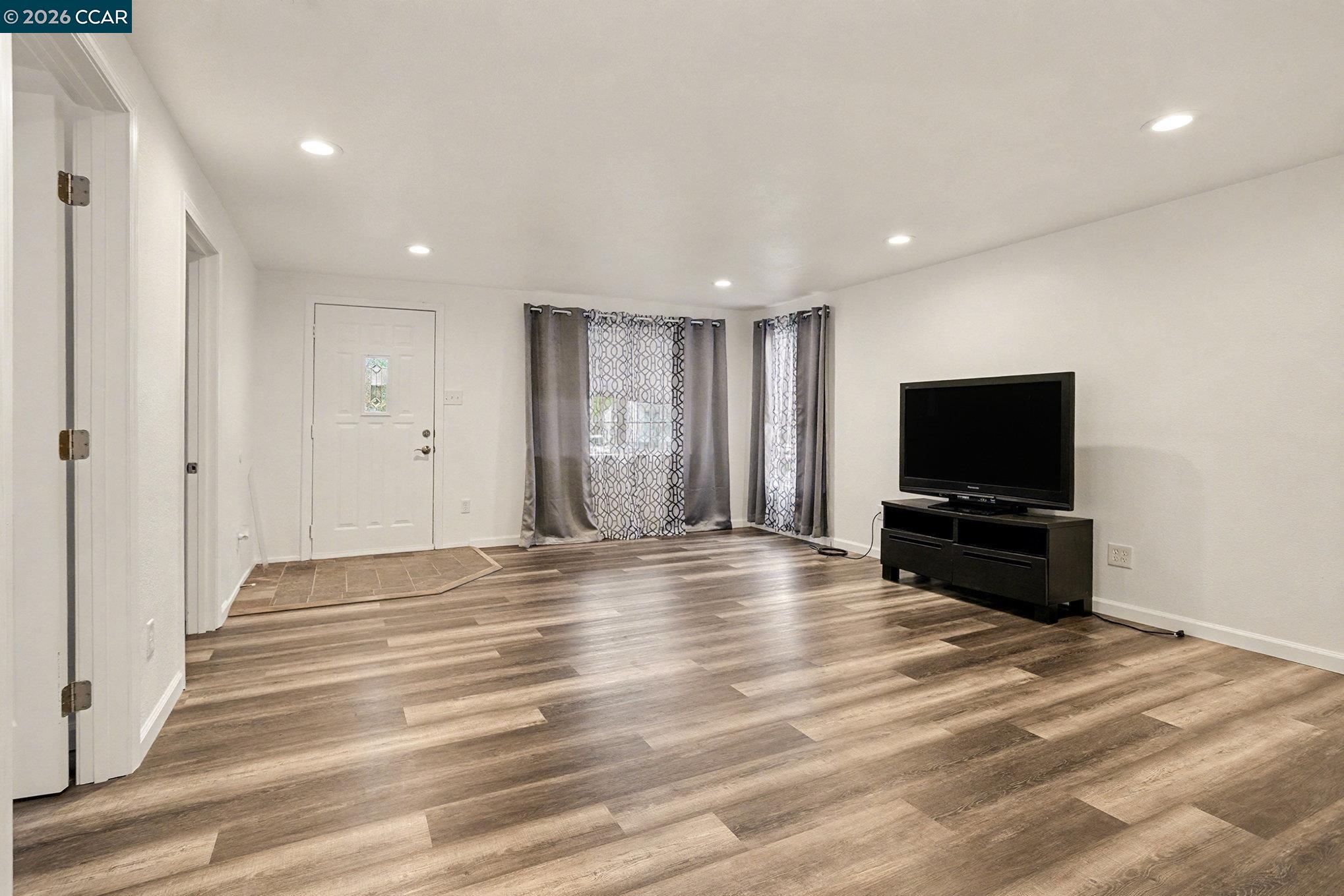 4041-4047 Ellis Road Martinez, CA 94553 - Photo 5 of 20 a living room with furniture and a flat screen tv