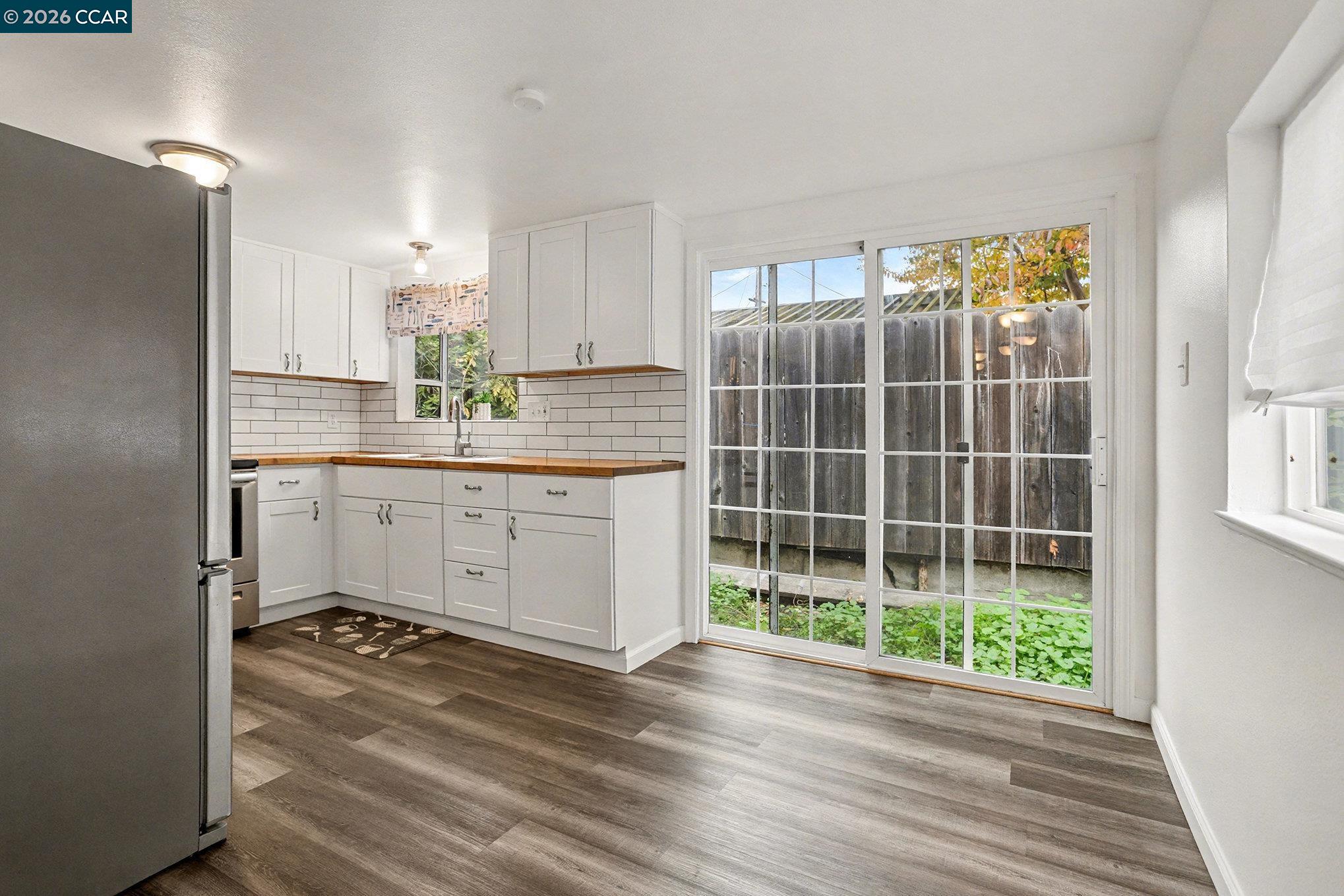 4041-4047 Ellis Road Martinez, CA 94553 - Photo 7 of 20 a kitchen with counter top space and wooden floor