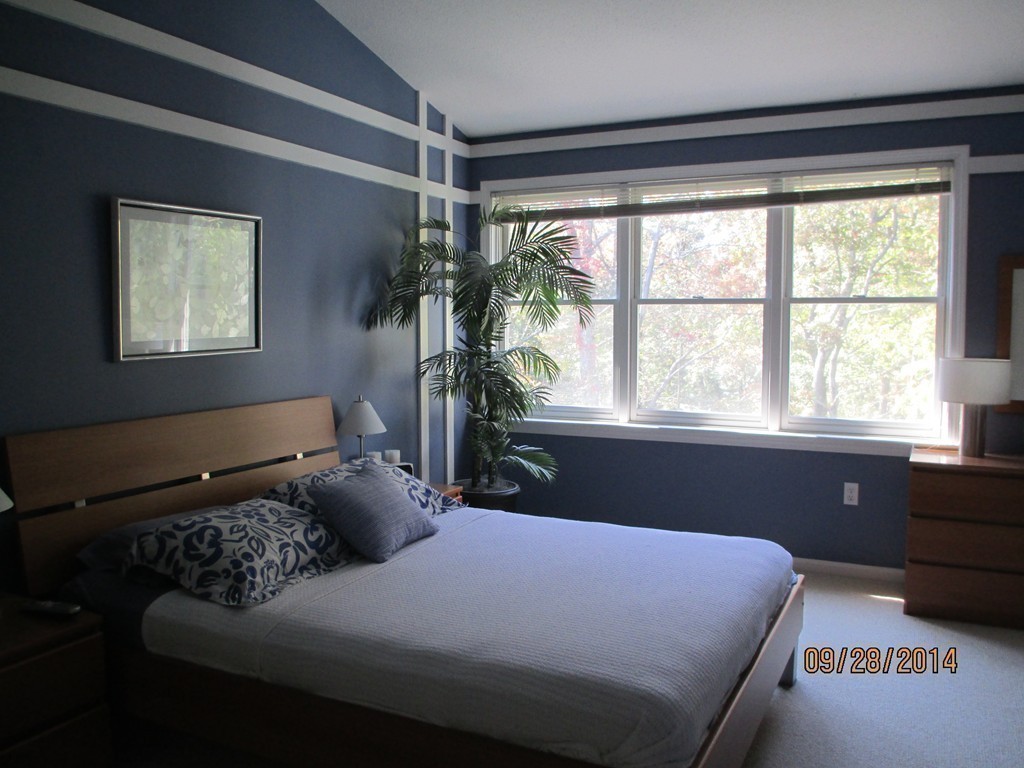 335 Bishops Forest Drive, Unit 335 Waltham, MA 02452 - Photo 13 of 21 a bedroom with a bed and a window