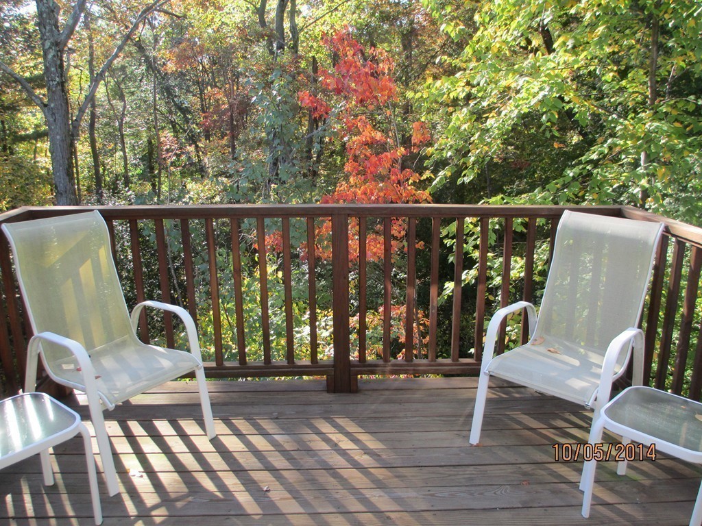 335 Bishops Forest Drive, Unit 335 Waltham, MA 02452 - Photo 9 of 21 a view of a chair and tables