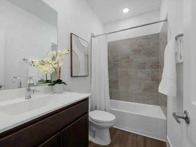 a bathroom with a sink a toilet and a bathtub