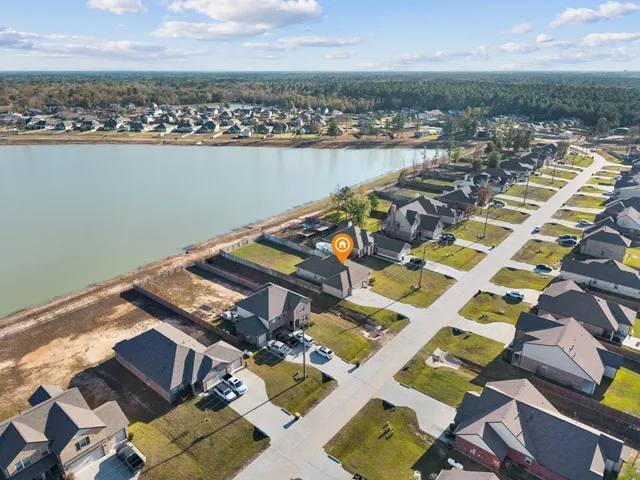 an aerial view of a city with ocean view