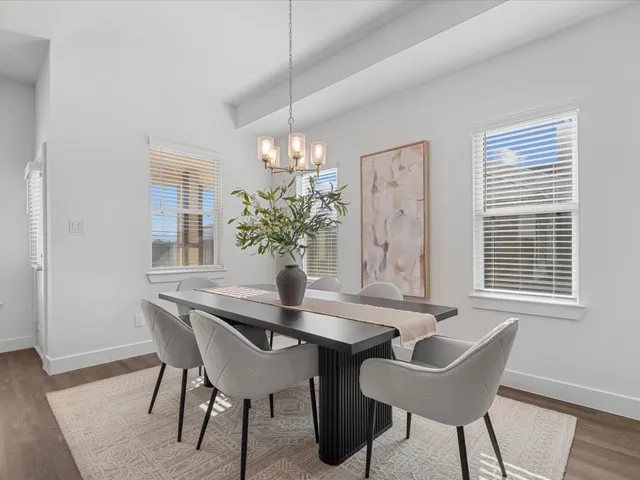 a dining room with furniture and window