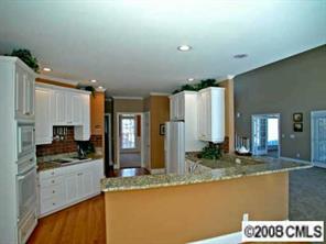 245 Edgewater Way Fort Mill, SC 29708 - Photo 6 of 8 a kitchen with stainless steel appliances granite countertop a sink and a stove