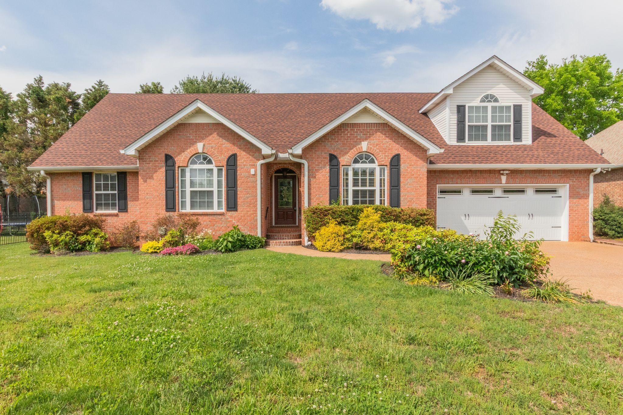 front view of a house with a yard