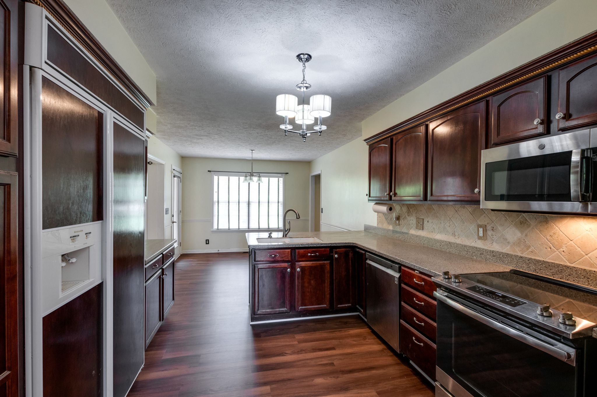 807 Judson Close Murfreesboro, TN 37130 - Photo 7 of 31 a large kitchen with stainless steel appliances granite countertop a stove and a sink