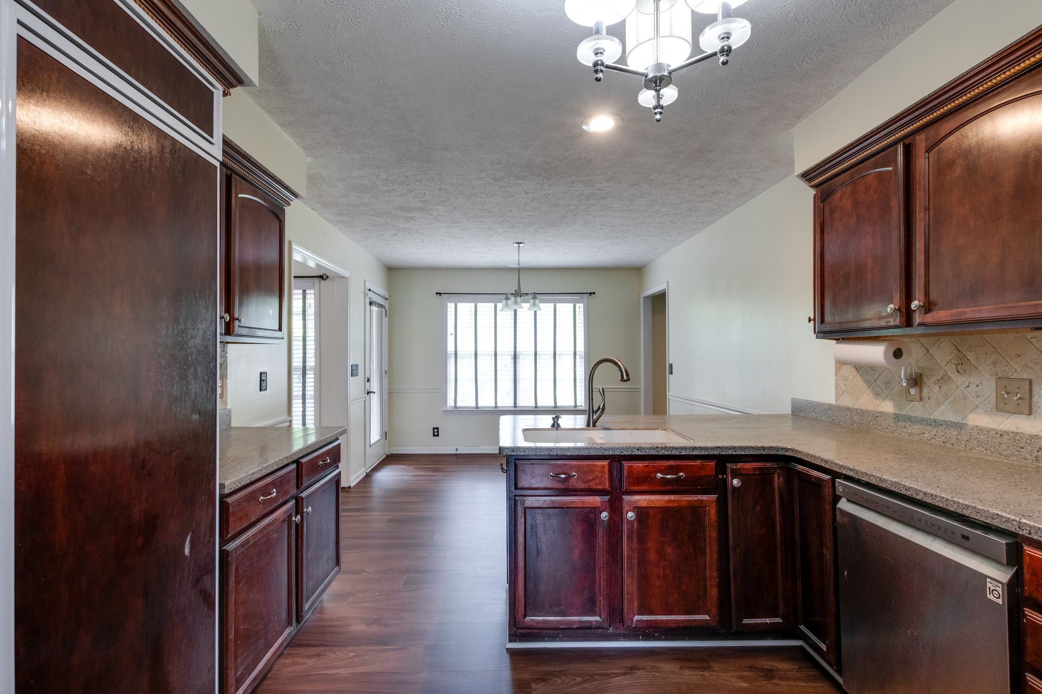 807 Judson Close Murfreesboro, TN 37130 - Photo 10 of 31 a kitchen with kitchen island granite countertop a sink stainless steel appliances and cabinets