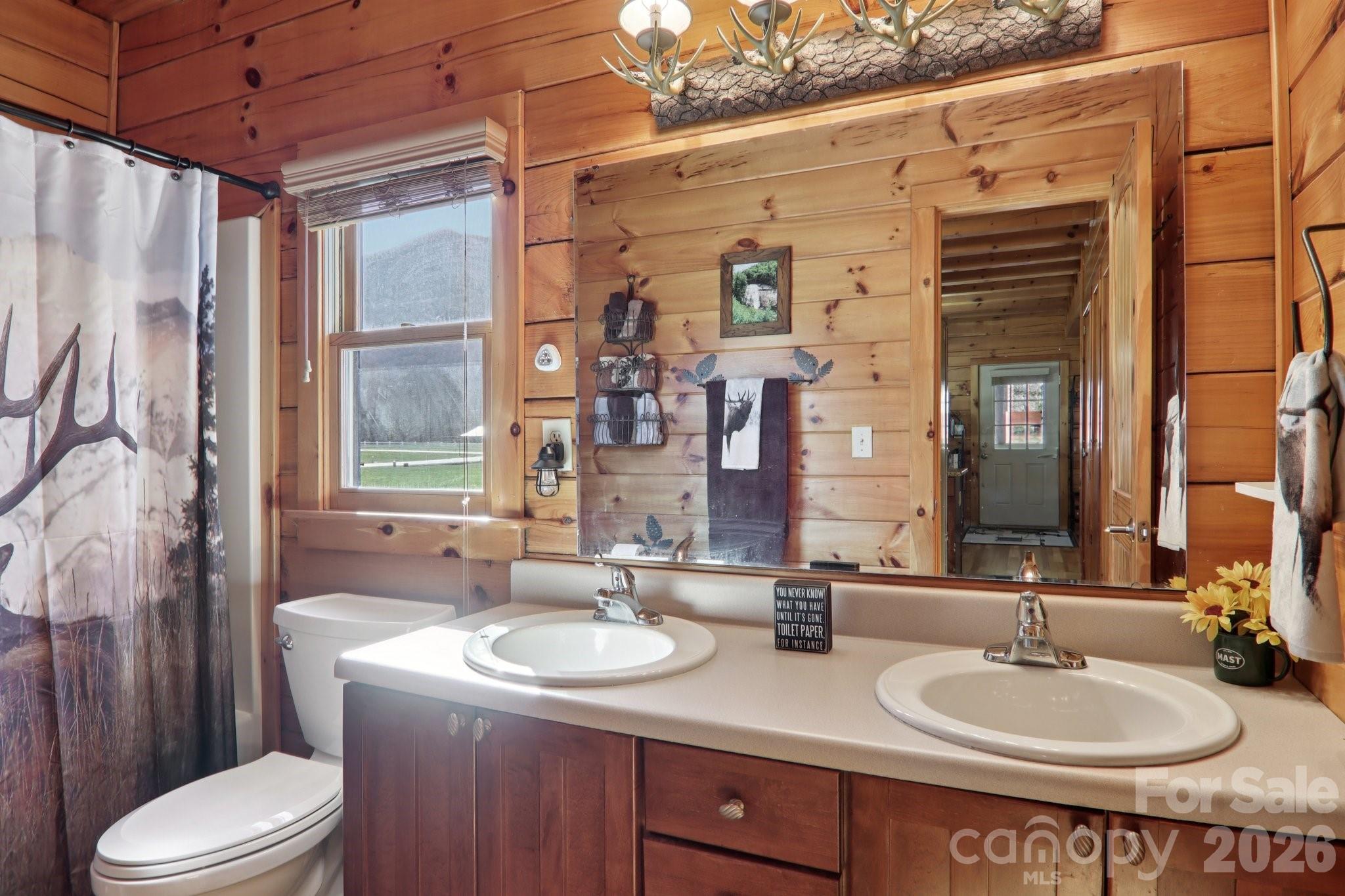 54 Meandering Way Maggie Valley, NC 28751 - Photo 16 of 47 a bathroom with a granite countertop sink toilet and shower