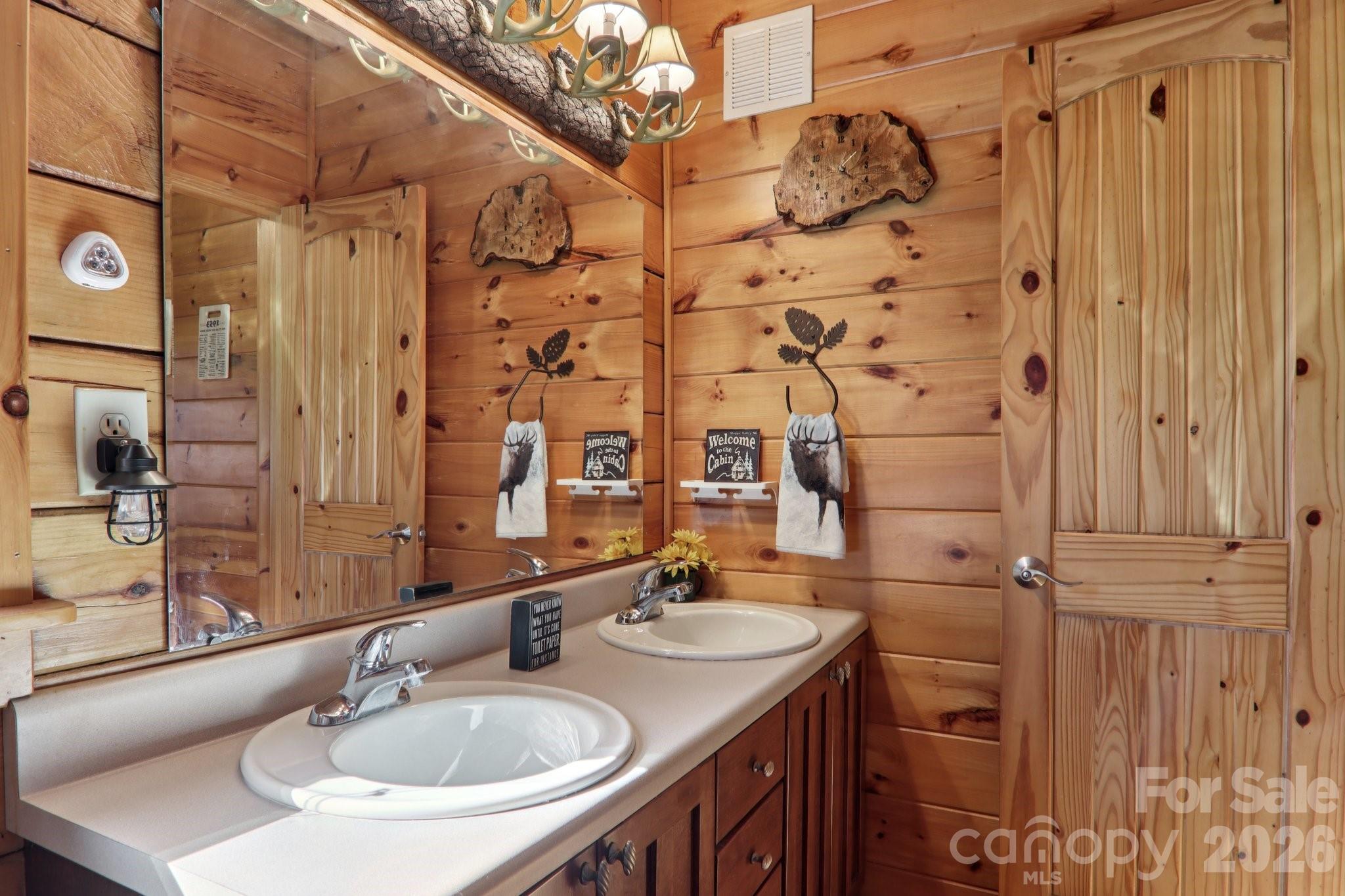 54 Meandering Way Maggie Valley, NC 28751 - Photo 18 of 47 a bathroom with a sink and a mirror