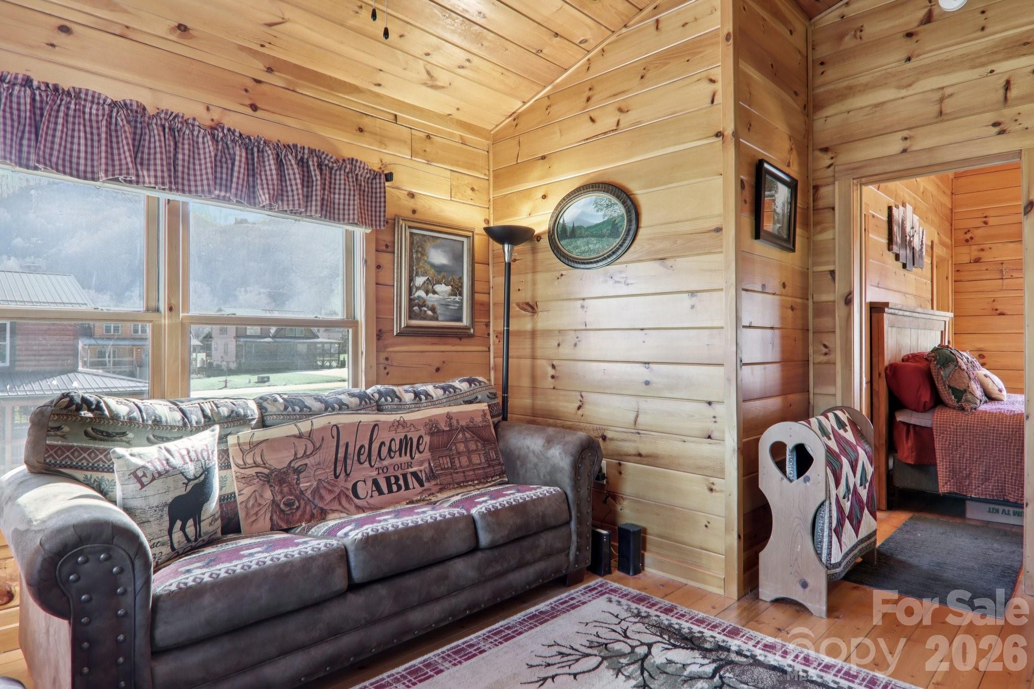 54 Meandering Way Maggie Valley, NC 28751 - Photo 20 of 47 a view of a livingroom with furniture and a window