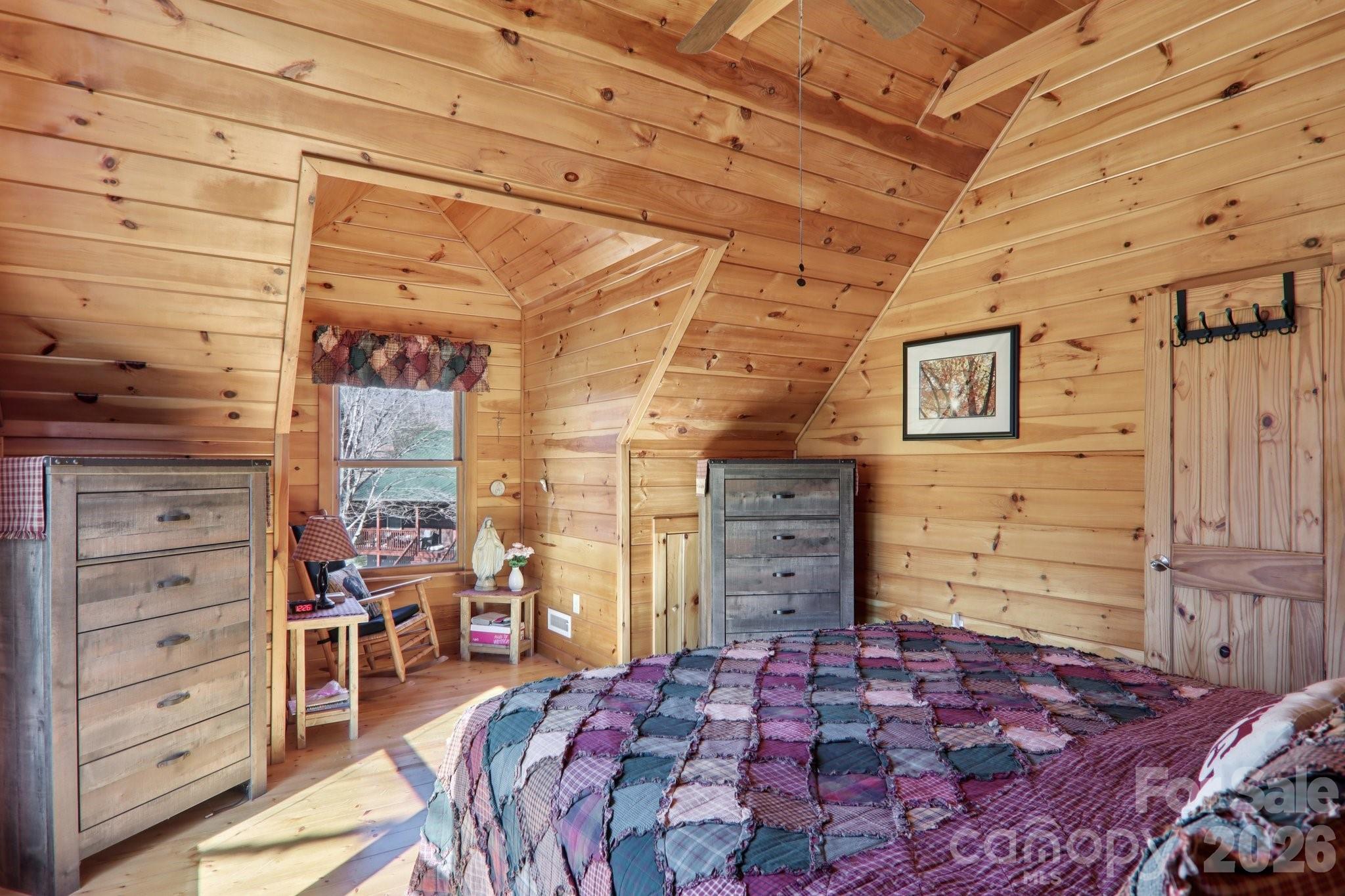 54 Meandering Way Maggie Valley, NC 28751 - Photo 22 of 47 a bedroom with a bed and a dresser
