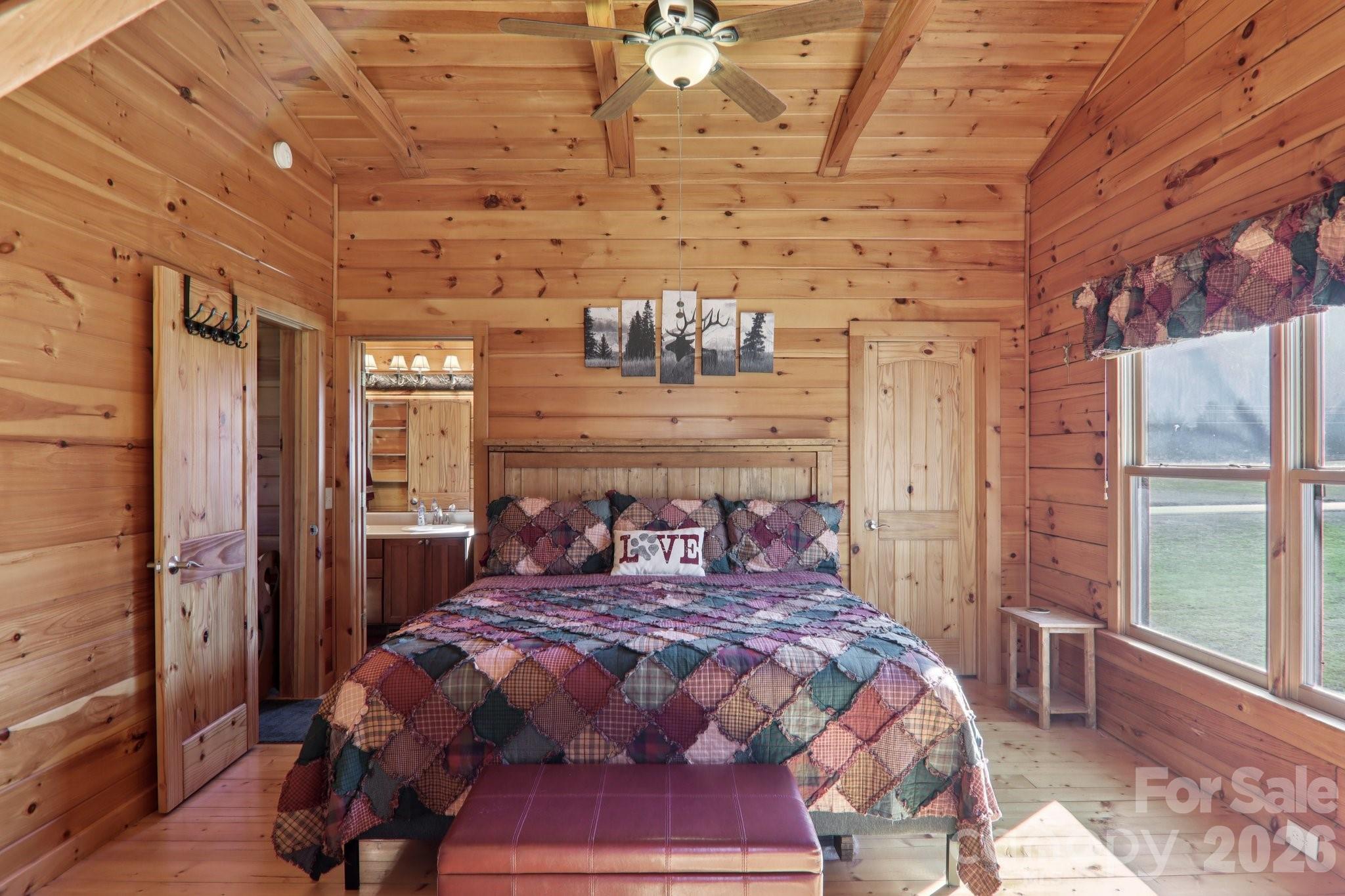 54 Meandering Way Maggie Valley, NC 28751 - Photo 23 of 47 a bedroom with a bed and wooden floor