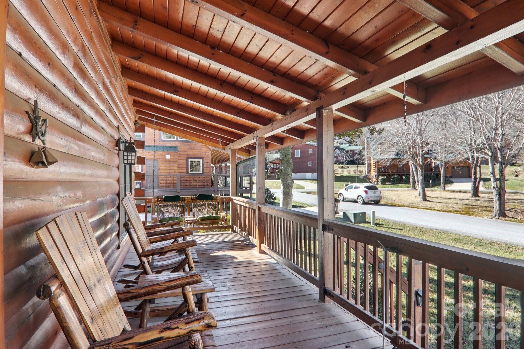 54 Meandering Way Maggie Valley, NC 28751 - Photo 28 of 47 a view of a porch with wooden floor