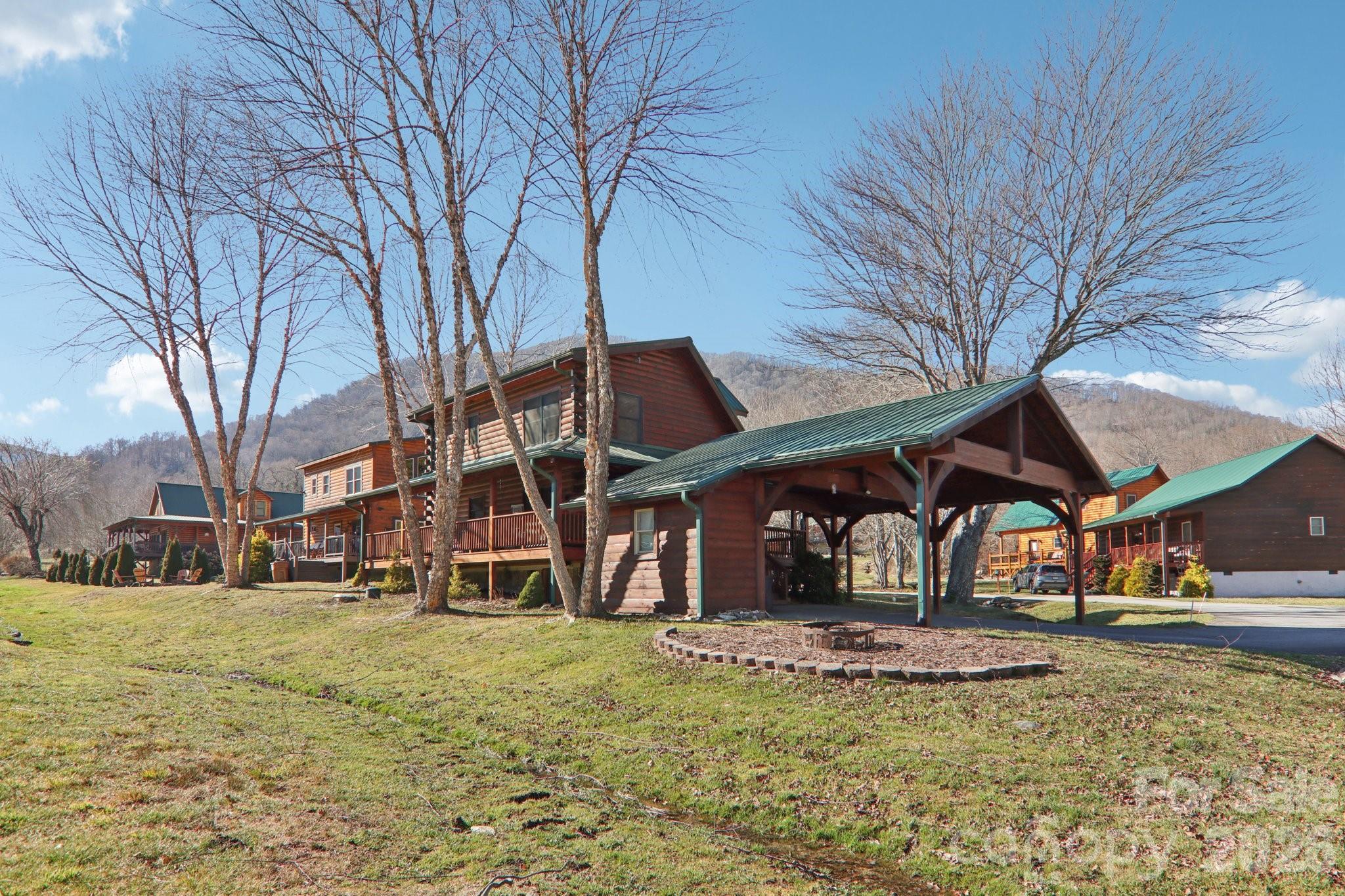 54 Meandering Way Maggie Valley, NC 28751 - Photo 34 of 47 a view of a house with a yard