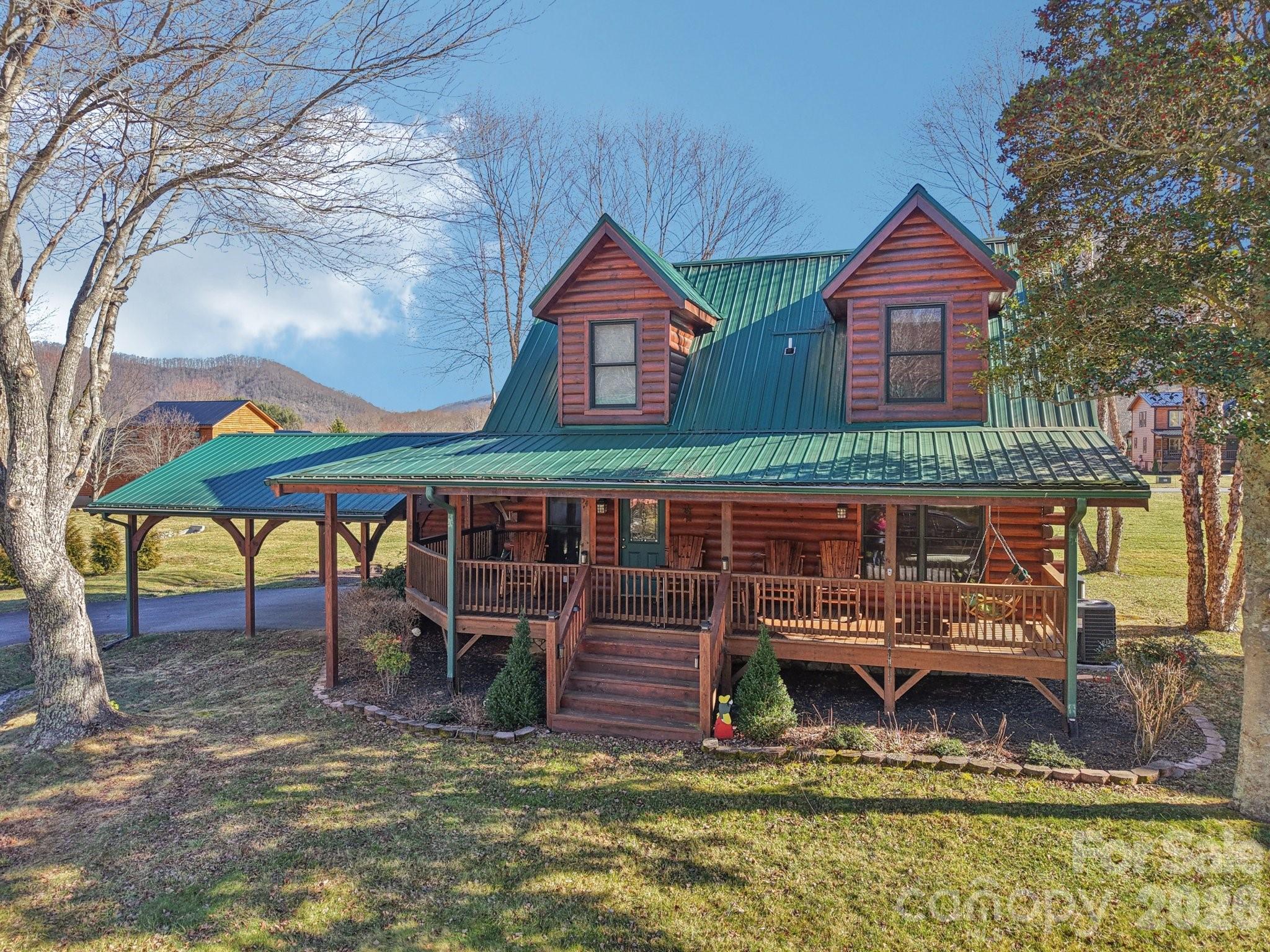 54 Meandering Way Maggie Valley, NC 28751 - Photo 41 of 47 a view of a house with wooden fence