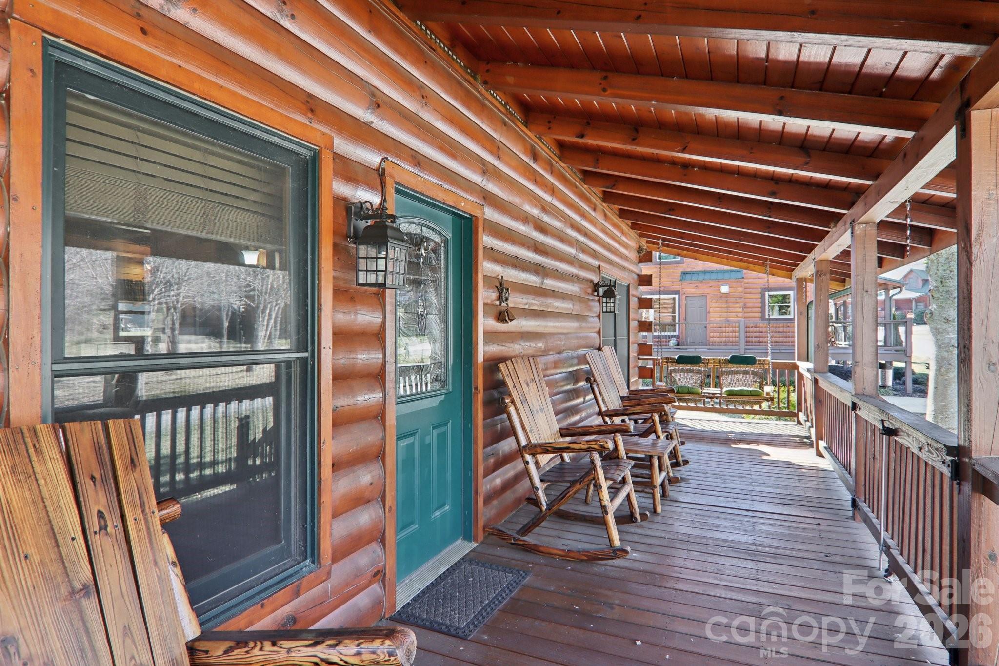 54 Meandering Way Maggie Valley, NC 28751 - Photo 5 of 47 a view of a porch with wooden floor