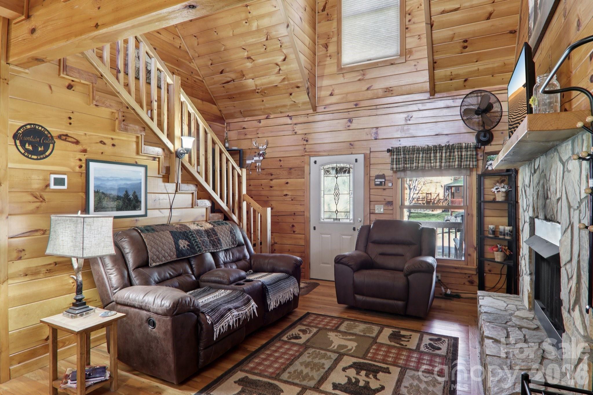 54 Meandering Way Maggie Valley, NC 28751 - Photo 6 of 47 a living room with furniture and a fireplace
