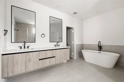 a bathroom with 2 sink and a mirror