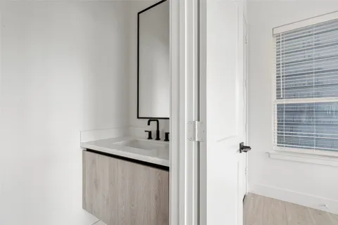 a bathroom with a sink and a mirror