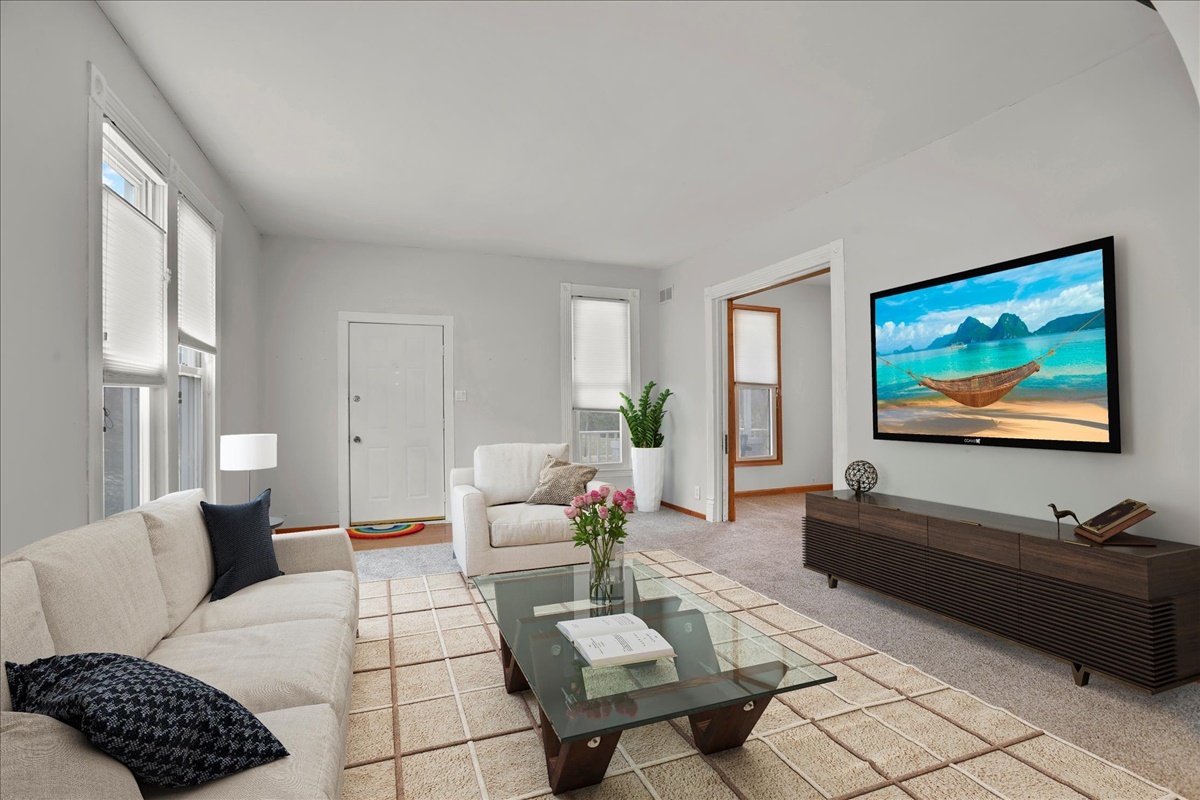 712 Bell Street Bloomington, IL 61701 - Photo 2 of 14 a living room with furniture and a flat screen tv