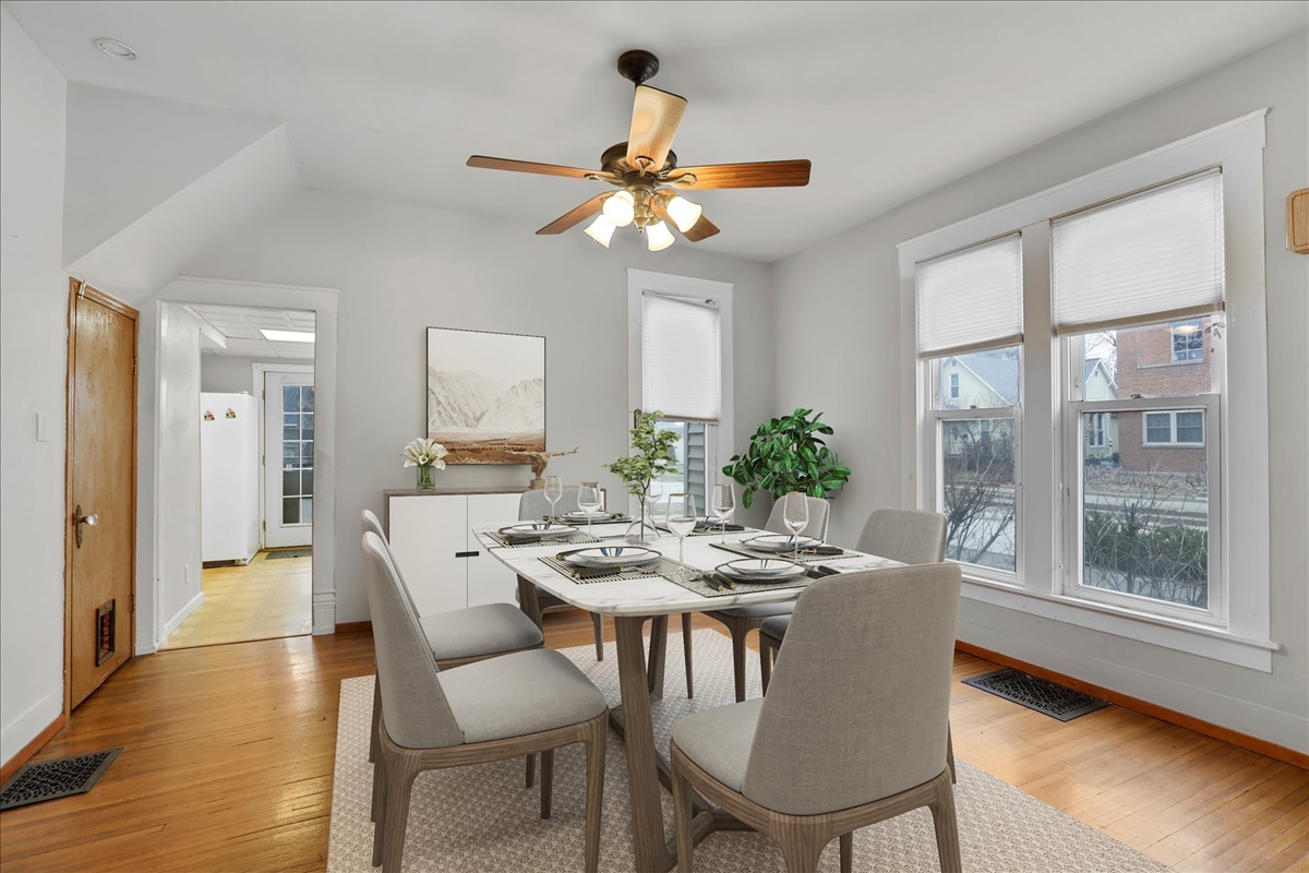 712 Bell Street Bloomington, IL 61701 - Photo 3 of 14 a dining room with furniture a window and wooden floor