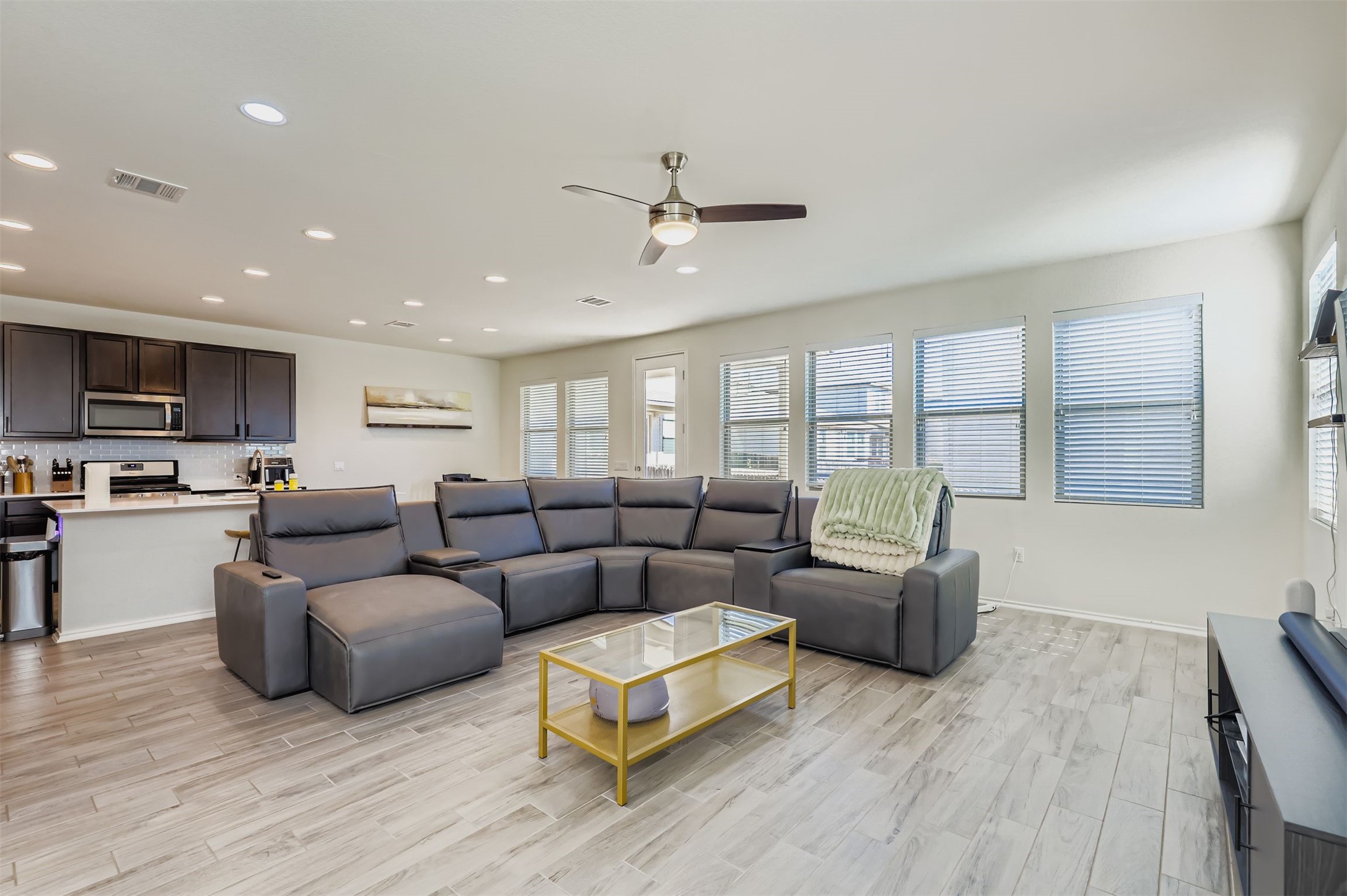 15203 Wallaby Way Austin, TX 78728 - Photo 4 of 26 a living room with furniture and a wooden floor