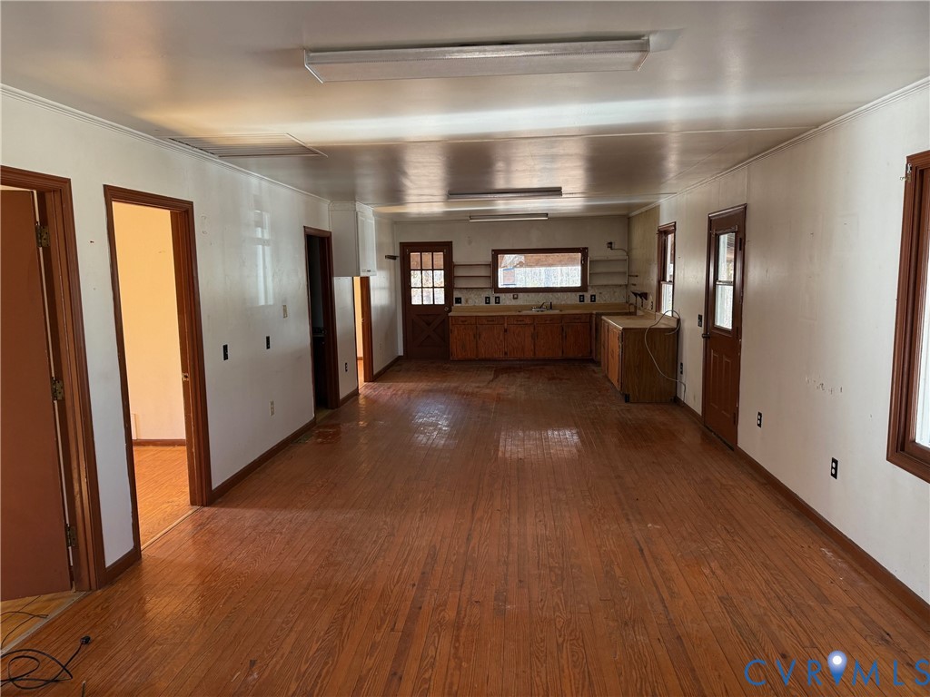 360 Clinton Road Cumberland, VA 23040 - Photo 19 of 33 Hallway featuring dark wood-style flooring and orn