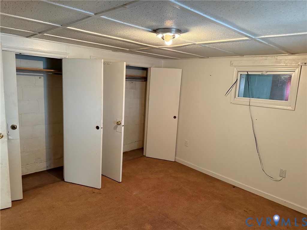 360 Clinton Road Cumberland, VA 23040 - Photo 33 of 33 Unfurnished bedroom with concrete block wall and m