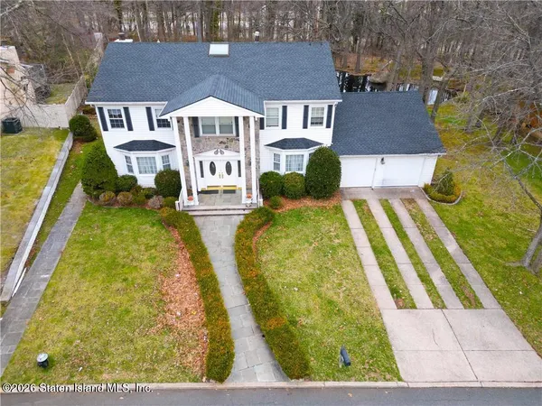 a aerial view of a house with swimming pool