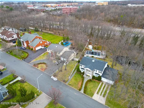 an aerial view of a house with a swimming pool