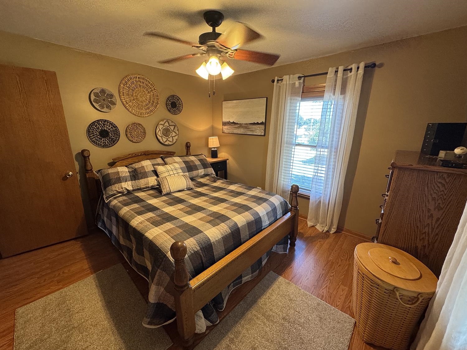 80 Snow Street Chadwick, IL 61014 - Photo 37 of 44 a bedroom with a bed and wooden floor