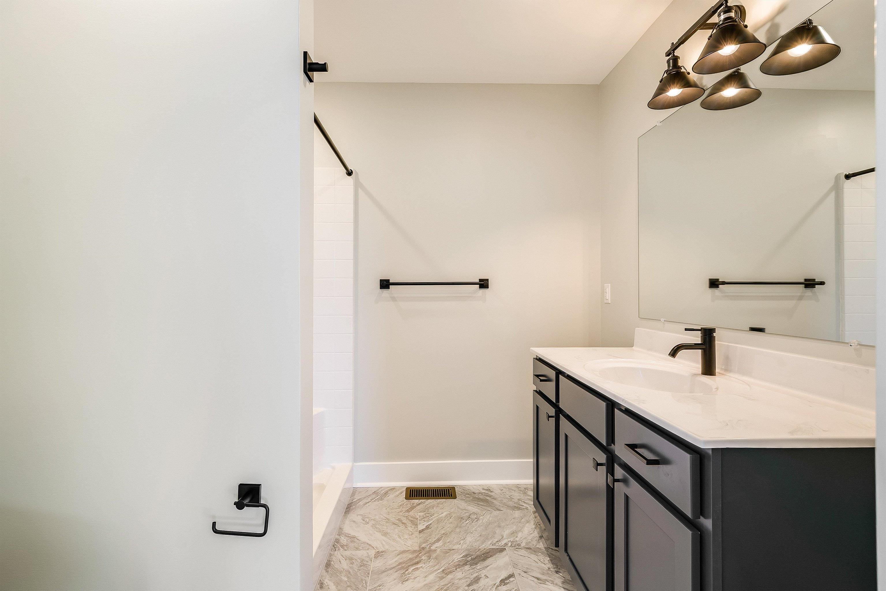 5 Barnyard Circle Bridgewater, VA 22812 - Photo 20 of 75 a bathroom with a sink a vanity and mirror