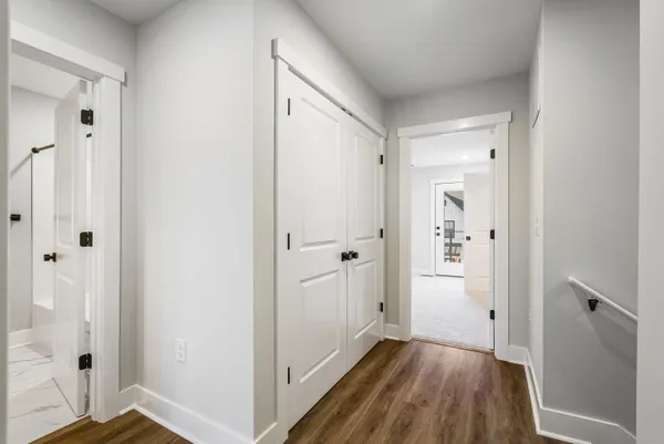 a bedroom with a bed and a walk in closet