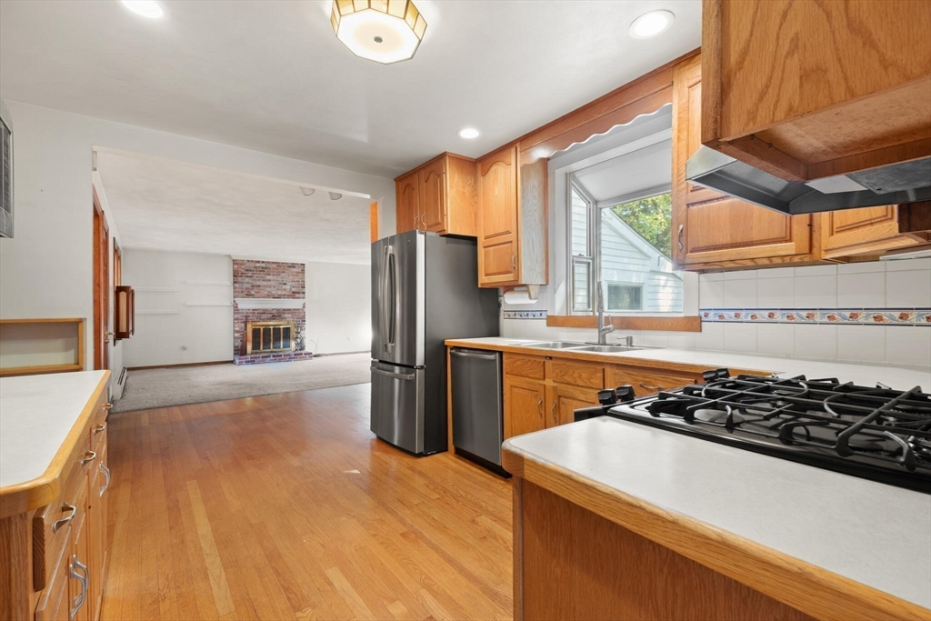 214 Graniteville Road Chelmsford, MA 01824 - Photo 13 of 42 a kitchen with stainless steel appliances granite countertop a refrigerator and a stove