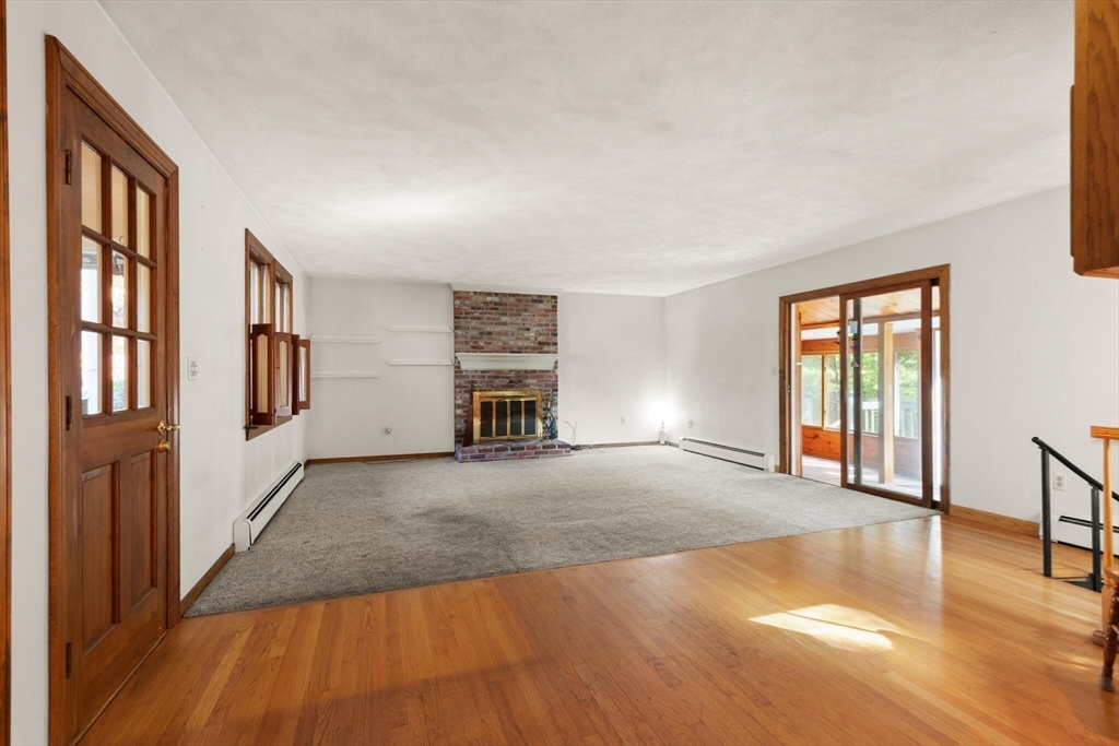 214 Graniteville Road Chelmsford, MA 01824 - Photo 14 of 42 a view of an empty room with window and wooden floor
