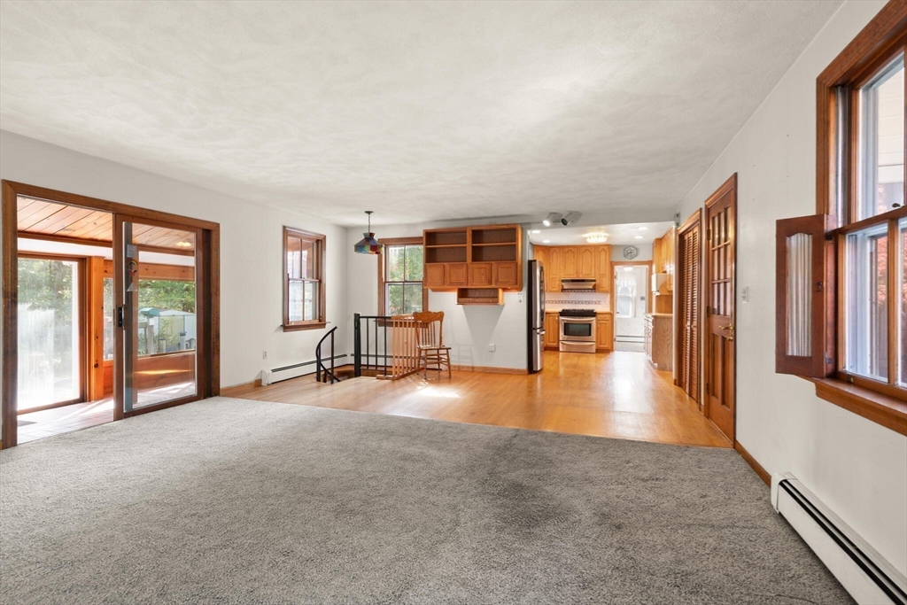 214 Graniteville Road Chelmsford, MA 01824 - Photo 17 of 42 wooden floor in an empty room with a window