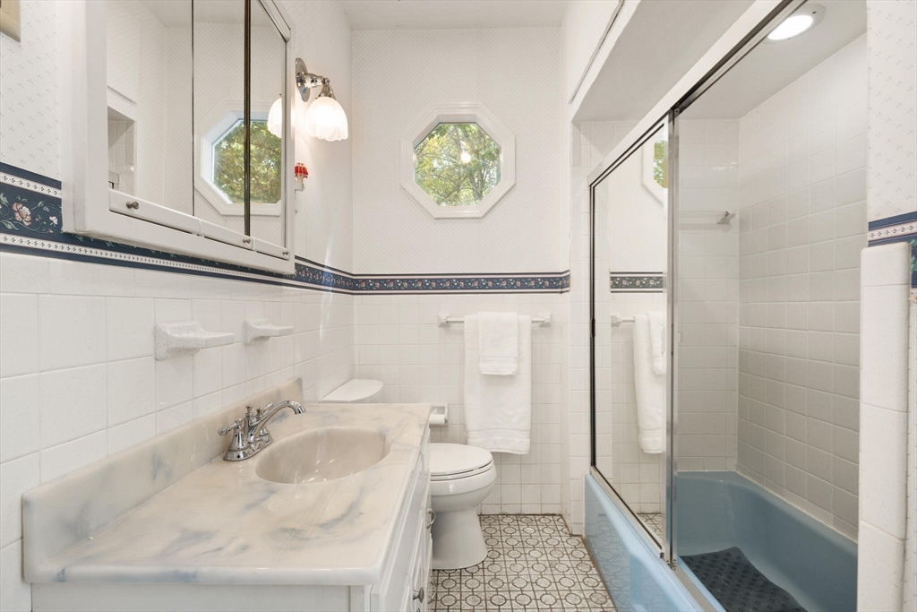 214 Graniteville Road Chelmsford, MA 01824 - Photo 25 of 42 a bathroom with a sink a toilet and shower