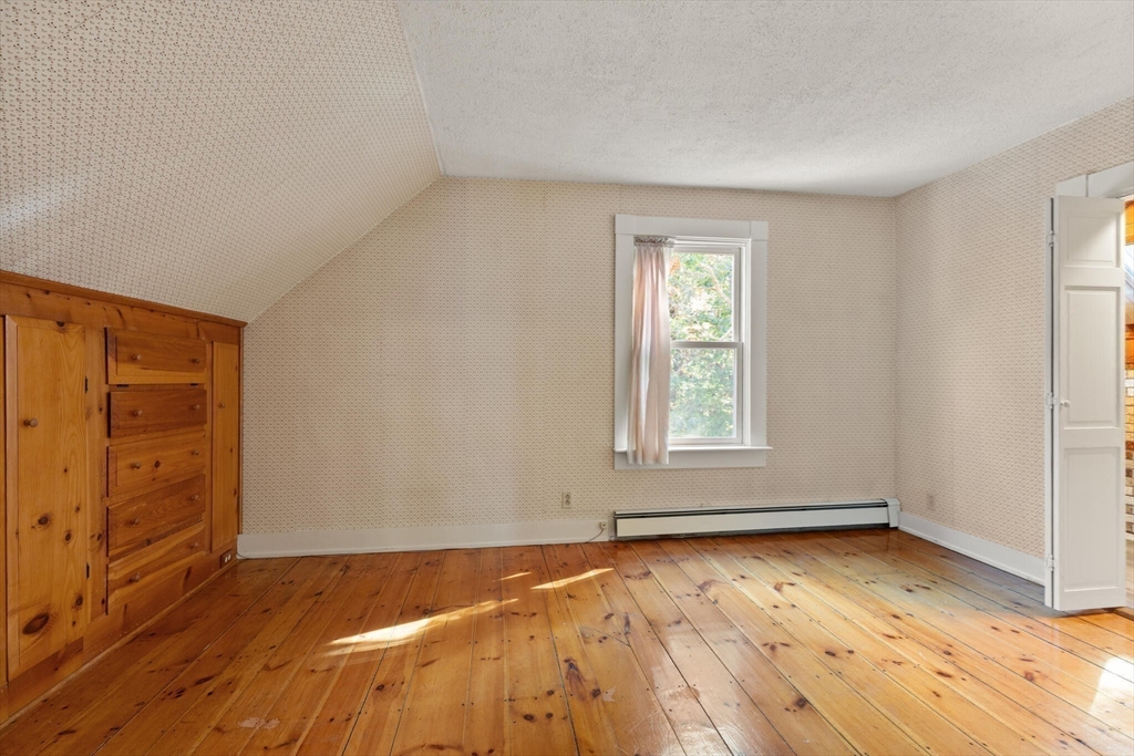 214 Graniteville Road Chelmsford, MA 01824 - Photo 29 of 42 an empty room with wooden floor and windows