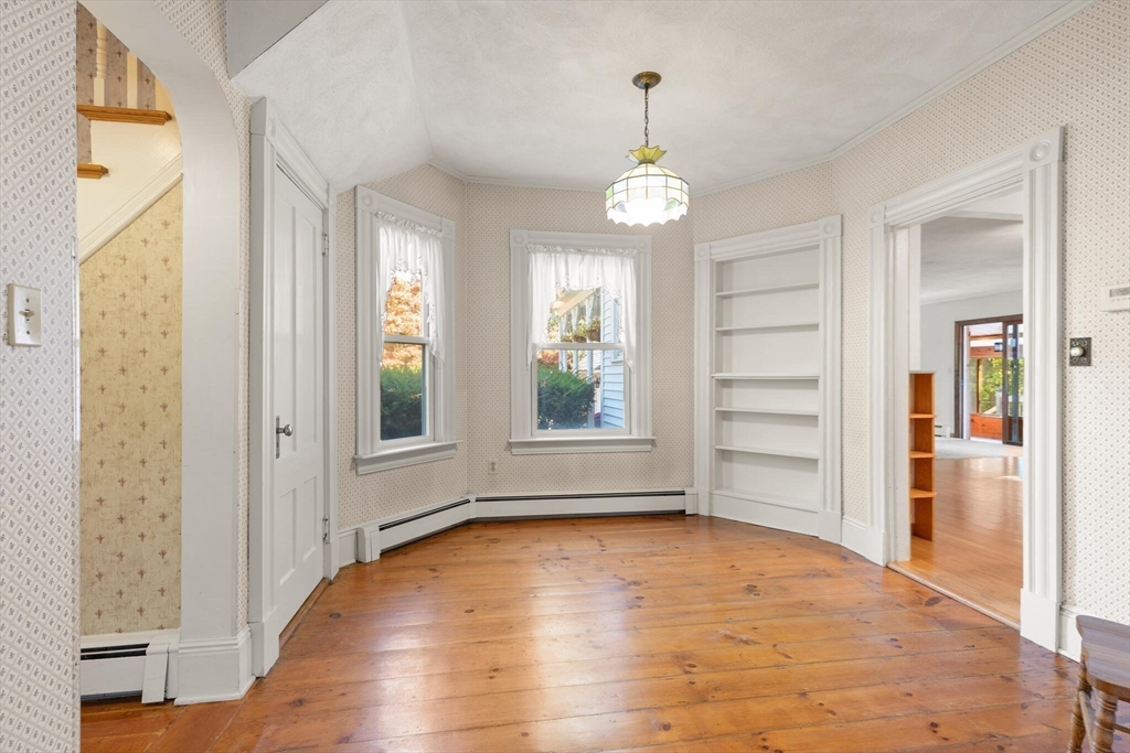 214 Graniteville Road Chelmsford, MA 01824 - Photo 10 of 42 wooden floor in an empty room with a window