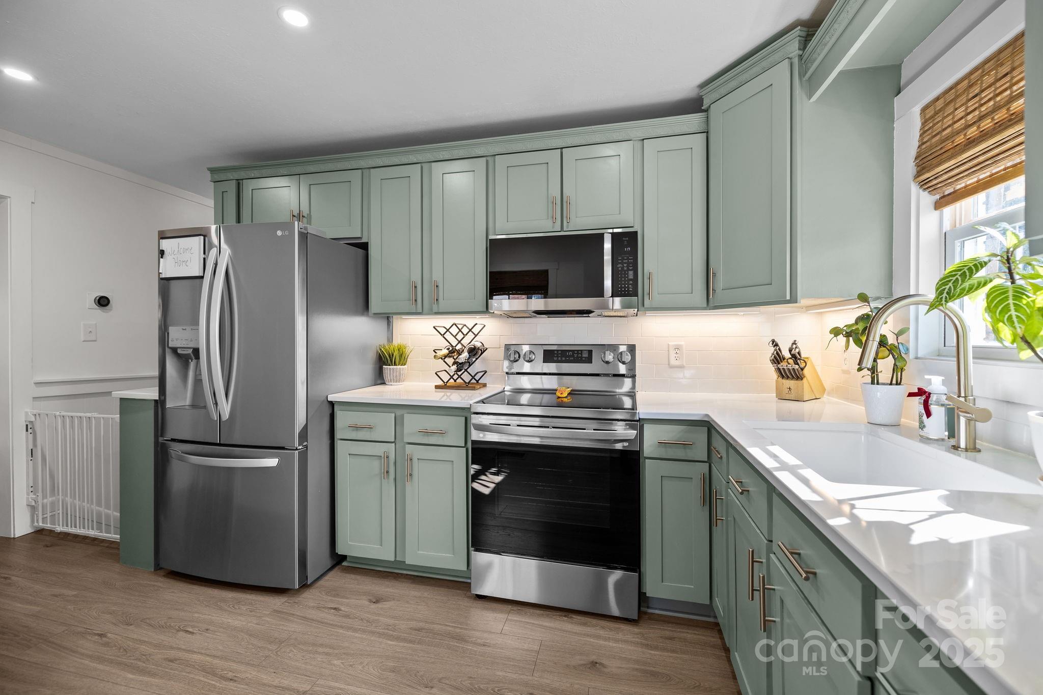 5509 Southampton Road Charlotte, NC 28217 - Photo 11 of 35 a kitchen with a sink stove and refrigerator