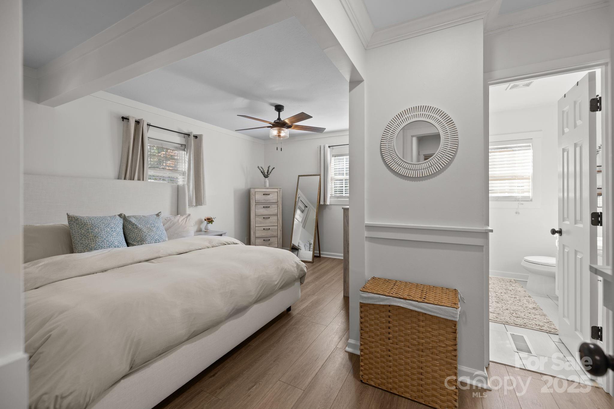 5509 Southampton Road Charlotte, NC 28217 - Photo 14 of 35 a bedroom with a bed and a chandelier