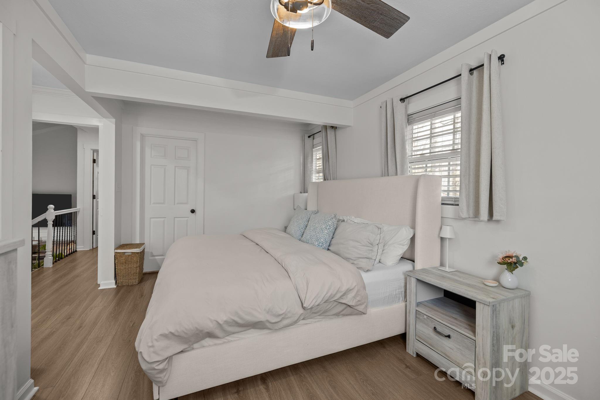 5509 Southampton Road Charlotte, NC 28217 - Photo 15 of 35 a bedroom with a bed and wooden floor