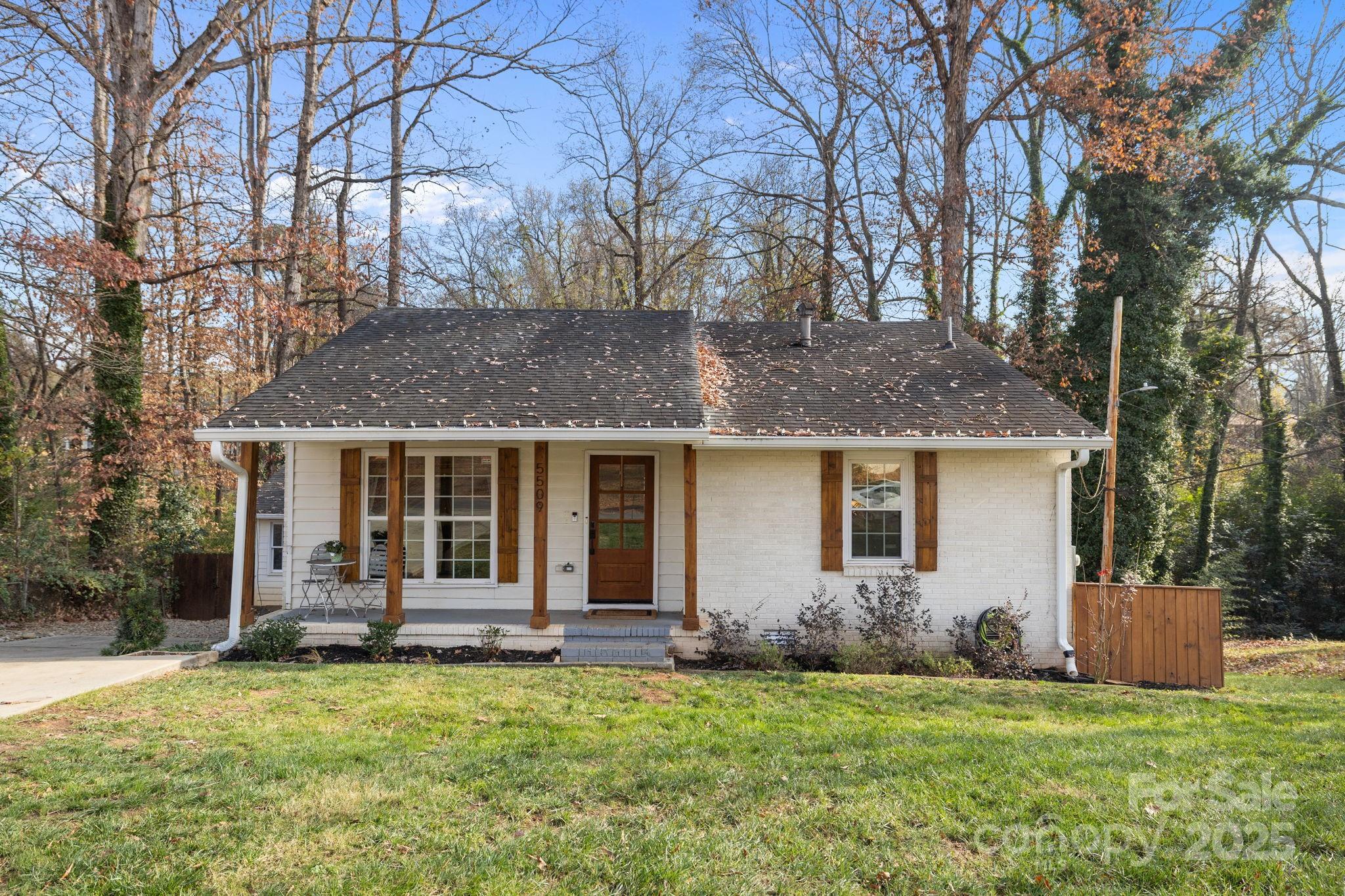 5509 Southampton Road Charlotte, NC 28217 - Photo 2 of 35 a view of a house with backyard and trees