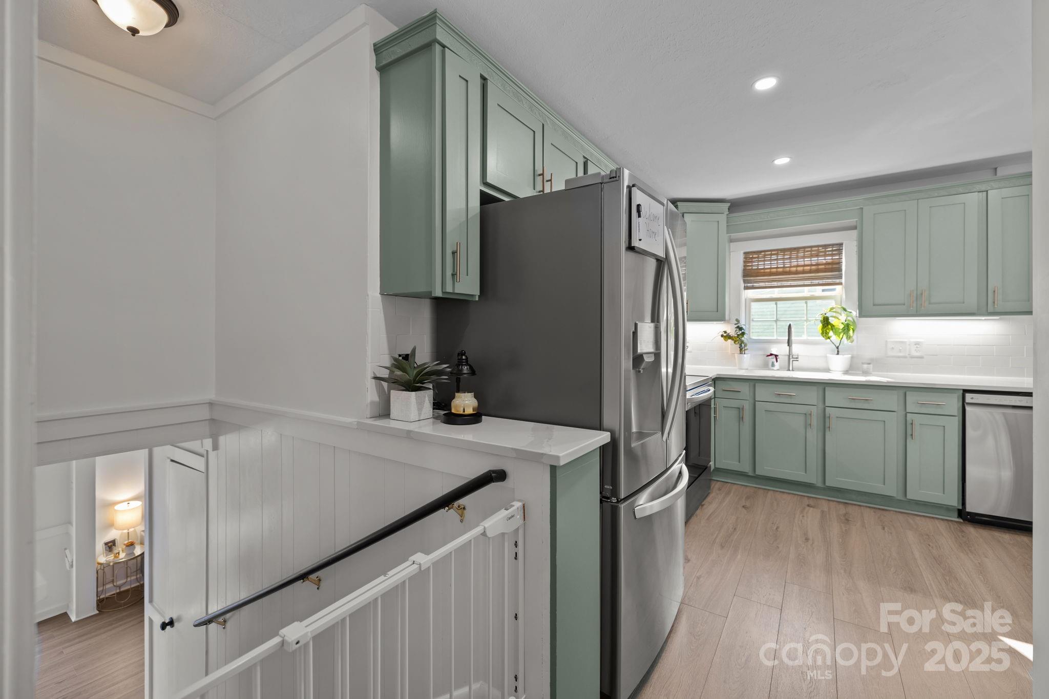 5509 Southampton Road Charlotte, NC 28217 - Photo 8 of 35 a kitchen with a refrigerator a sink and cabinets