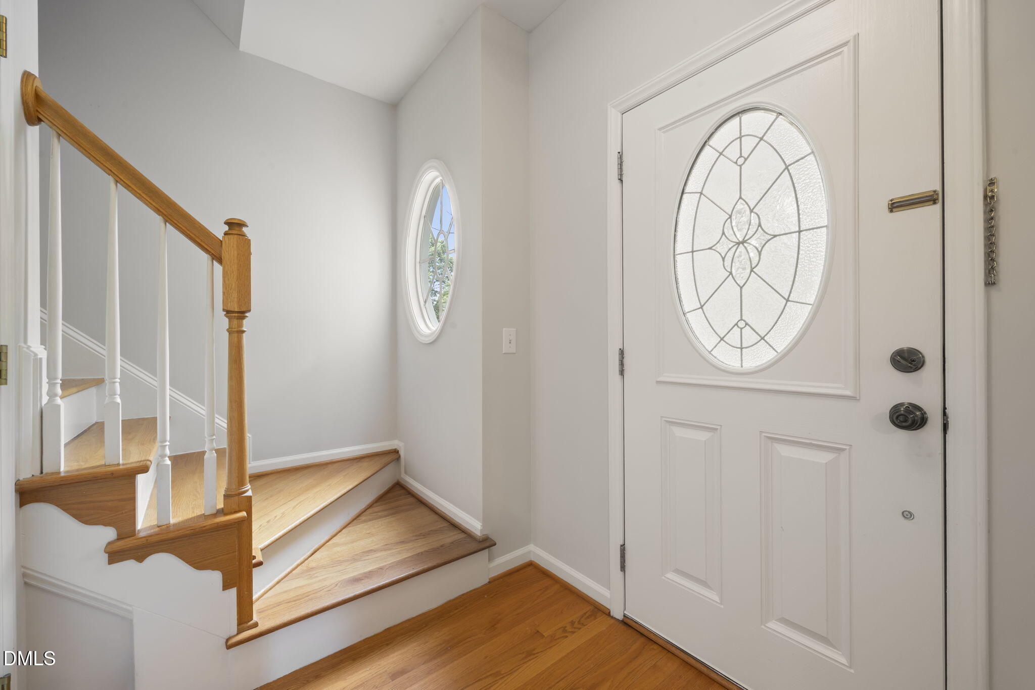 1008 Scotts Ridge Trail Apex, NC 27502 - Photo 13 of 57 a view of an entryway with wooden floor
