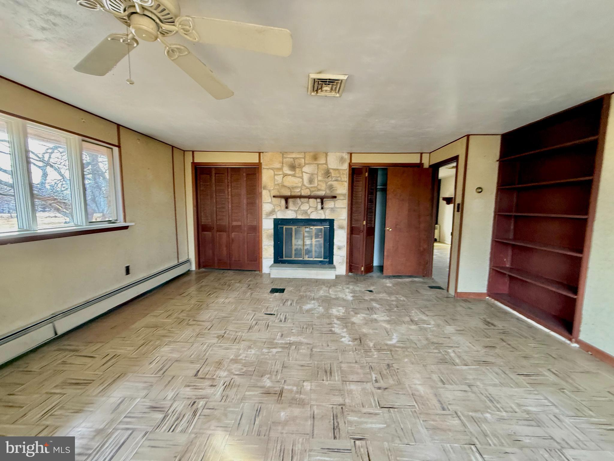 175 West Branch Road Barto, PA 19504 - Photo 14 of 17 a view of an empty room with a fireplace and a window
